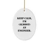 Gifts from Friends for Engineer's Christmas - 'Keep Calm, I'm (almost) An Engineer.' Oval Ornament, White, 3.25" tall - Image 1